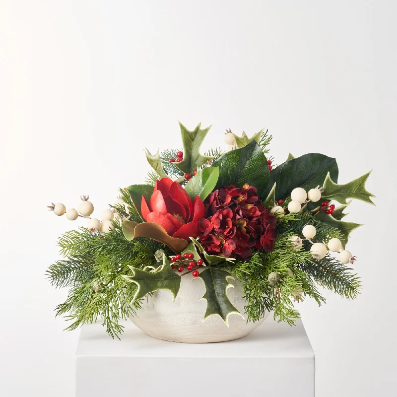 Red Berry Holly, Real Touch Magnolia & Burgundy Hydrangea Winter Holiday Arrangement in Rustic Wood Bowl